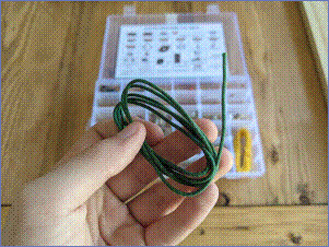 Holding clothed
      wire from electronics kit